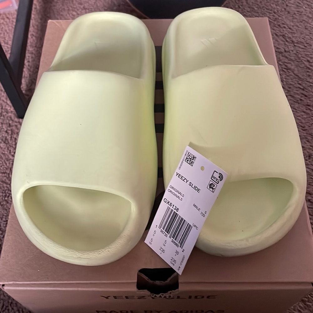 Yeezy Slides. Gently worn. With original box.